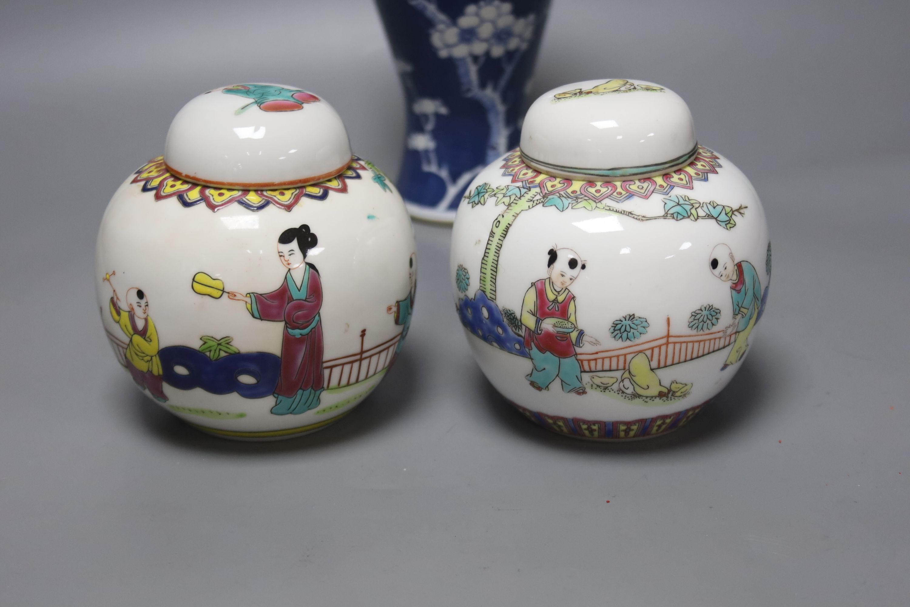 A Chinese blue and white vase and cover, a pair of famille rose jars and covers and two other jars and covers, tallest 27cm